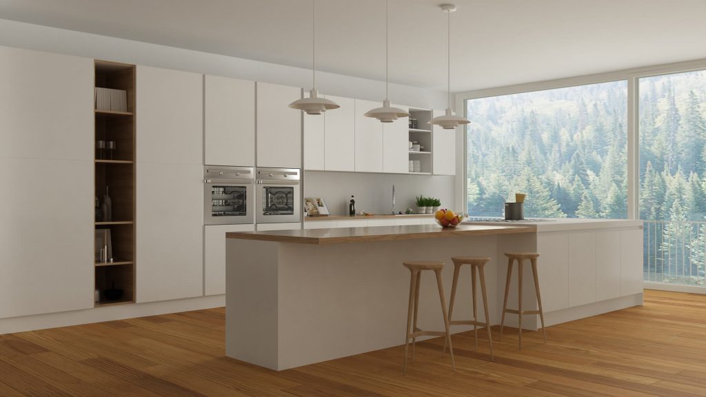 Cocina blanco mate con gola vertical, se deja espacio para situar taburetes
